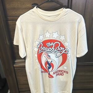 Beige Graphic Tee with Red and Blue Design